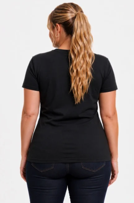 Back facing image of a plus size Caucasian model wearing a black crew neck, relaxed fit t-shirt